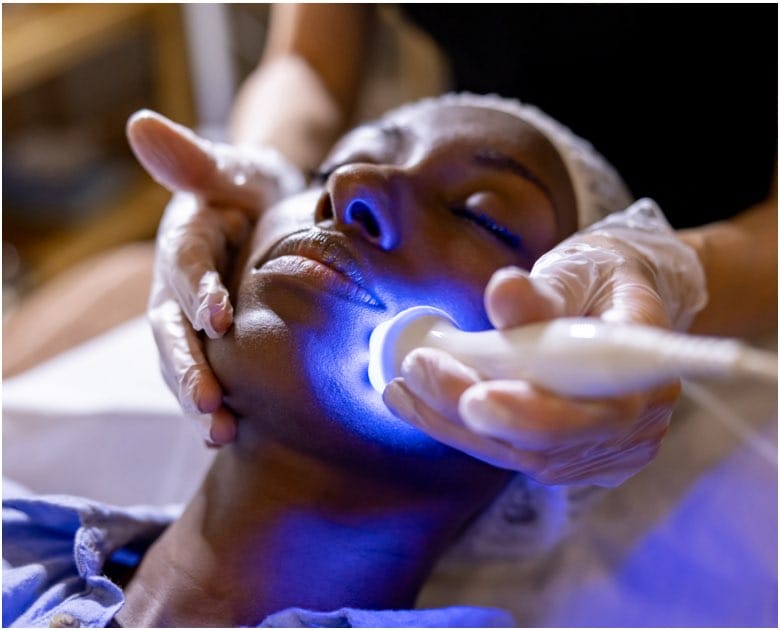 Young african american women gettign a UV light treatment